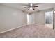 Spacious bedroom with plush carpet, closet, ensuite bath with newly renovated shower at 5215 Mainstreet Park Dr, Stone Mountain, GA 30088