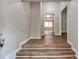 Spacious entryway featuring hardwood flooring and neutral paint at 5215 Mainstreet Park Dr, Stone Mountain, GA 30088