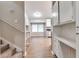 View showing entry to the staircase, kitchen and a spacious living area at 5215 Mainstreet Park Dr, Stone Mountain, GA 30088