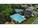 Aerial view of the community pool, tennis courts and clubhouse at 217 Fernwood Pl, Woodstock, GA 30188