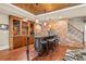 The basement bar features a brick backsplash, hardwood floors, and custom cabinetry at 217 Fernwood Pl, Woodstock, GA 30188