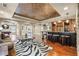 The finished basement has a bar, game room and ample seating for guests at 217 Fernwood Pl, Woodstock, GA 30188