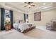 Spacious bedroom with neutral colors, trey ceiling, large window, and a ceiling fan at 217 Fernwood Pl, Woodstock, GA 30188