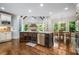 Kitchen with stone countertops, stainless appliances, dark wood cabinets, and breakfast nook at 217 Fernwood Pl, Woodstock, GA 30188