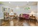 Cozy living room with hardwood floors, decorative furniture, and natural light at 217 Fernwood Pl, Woodstock, GA 30188