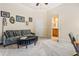 Comfortable sitting room with modern sofa and decor and en-suite bathroom at 217 Fernwood Pl, Woodstock, GA 30188
