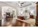 This primary bedroom features hardwood floors, recessed lighting, and a fireplace sitting area at 217 Fernwood Pl, Woodstock, GA 30188