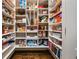 Walk-in pantry with organized shelving, providing ample storage space for food and household items at 217 Fernwood Pl, Woodstock, GA 30188