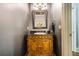 Chic powder room featuring a vessel sink and vanity with decorative framed mirror at 217 Fernwood Pl, Woodstock, GA 30188