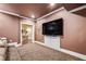 Home theater with large screen TV, built in cabinets and custom carpet at 217 Fernwood Pl, Woodstock, GA 30188