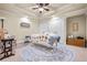 Massage therapy room featuring a massage table, neutral colors, and a ceiling fan at 217 Fernwood Pl, Woodstock, GA 30188