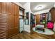 This expansive walk-in closet features custom cabinetry and hardwood flooring at 217 Fernwood Pl, Woodstock, GA 30188