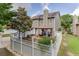 A fenced backyard featuring a patio area, gazebo with curtains, and lush greenery at 3900 Baluster Ct, Suwanee, GA 30024