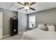 Comfortable bedroom with plush carpet, neutral walls, ample natural light, and a ceiling fan at 3900 Baluster Ct, Suwanee, GA 30024