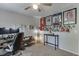 Bedroom/office combo with sports decor at 3900 Baluster Ct, Suwanee, GA 30024