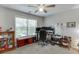 Bedroom with great natural light, fan and ample space for work or relaxation at 3900 Baluster Ct, Suwanee, GA 30024