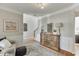 An inviting entryway with hardwood floors, a decorative console table, and neutral wall colors at 3900 Baluster Ct, Suwanee, GA 30024