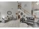 Open concept living room with stairs, neutral colors, and hardwood floors at 3900 Baluster Ct, Suwanee, GA 30024
