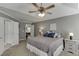 Cozy main bedroom with neutral paint, double doors and ensuite entrance boasts inviting space at 3900 Baluster Ct, Suwanee, GA 30024