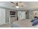 This well-lit main bedroom features ensuite entrance, ceiling fan and closet storage at 3900 Baluster Ct, Suwanee, GA 30024