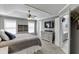 Spacious main bedroom has tray ceiling, gray walls, and a TV above the dresser at 3900 Baluster Ct, Suwanee, GA 30024