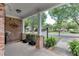 Porch featuring red brick and lush landscaping at 3900 Baluster Ct, Suwanee, GA 30024