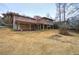 Expansive backyard view showcasing the home's deck and natural landscape at 4225 Parkridge Dr, Powder Springs, GA 30127
