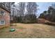 Large backyard with mature trees offering a private outdoor space, perfect for recreation at 4225 Parkridge Dr, Powder Springs, GA 30127