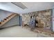 Basement area featuring a stone wall with a fireplace and carpet floors at 4225 Parkridge Dr, Powder Springs, GA 30127