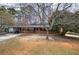 Traditional brick home with inviting front porch and mature trees at 4225 Parkridge Dr, Powder Springs, GA 30127