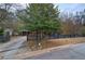 Charming home with black picket fence, mature trees, and well-maintained lawn at 4225 Parkridge Dr, Powder Springs, GA 30127