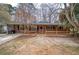 A cozy brick house featuring a covered front porch and a well-manicured yard at 4225 Parkridge Dr, Powder Springs, GA 30127