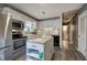 Cozy kitchen features white cabinets, stainless appliances, and a functional kitchen island at 4225 Parkridge Dr, Powder Springs, GA 30127
