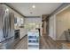 Charming kitchen with updated appliances, white cabinets and a convenient kitchen island at 4225 Parkridge Dr, Powder Springs, GA 30127