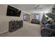 Open living room features carpeted floors, a ceiling fan, modern TV, and comfortable seating at 4225 Parkridge Dr, Powder Springs, GA 30127