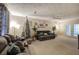 Comfortable living room features soft carpet, ceiling fan and an abundance of seating options at 4225 Parkridge Dr, Powder Springs, GA 30127