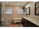 Elegant main bathroom featuring dual sinks and a classic clawfoot tub at 4225 Parkridge Dr, Powder Springs, GA 30127