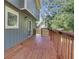 Back deck on a gray-blue house with wood railing at 597 Woodcrest Manor Dr, Stone Mountain, GA 30083