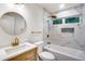 Bright bathroom featuring stylish marble tile, gold fixtures, and a modern vanity at 597 Woodcrest Manor Dr, Stone Mountain, GA 30083