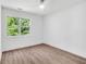 Bedroom featuring hardwood floors, ceiling fan, and white walls at 597 Woodcrest Manor Dr, Stone Mountain, GA 30083
