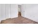 Bedroom with closet, hardwood floors, and white walls at 597 Woodcrest Manor Dr, Stone Mountain, GA 30083