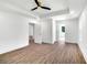 Open bedroom with wood floors and doorways to closet and bathroom at 597 Woodcrest Manor Dr, Stone Mountain, GA 30083