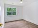 Cozy bedroom featuring hardwood floors and natural light at 597 Woodcrest Manor Dr, Stone Mountain, GA 30083