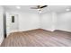 A bright bedroom with hardwood floors and a ceiling fan at 597 Woodcrest Manor Dr, Stone Mountain, GA 30083
