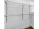 Walk-in closet with newly installed metal shelving at 597 Woodcrest Manor Dr, Stone Mountain, GA 30083