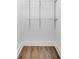 A walk-in closet features hardwood floors and metal shelving at 597 Woodcrest Manor Dr, Stone Mountain, GA 30083