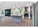 Open concept kitchen with stainless appliances, large island, and hardwood floors at 597 Woodcrest Manor Dr, Stone Mountain, GA 30083
