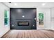 A living room showcases a fireplace, hardwood floors, and recessed lighting at 597 Woodcrest Manor Dr, Stone Mountain, GA 30083