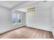 Bright, empty room with hardwood floors and a view from a double window at 597 Woodcrest Manor Dr, Stone Mountain, GA 30083