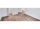 Room featuring hardwood floors, white walls, and doorway at 597 Woodcrest Manor Dr, Stone Mountain, GA 30083